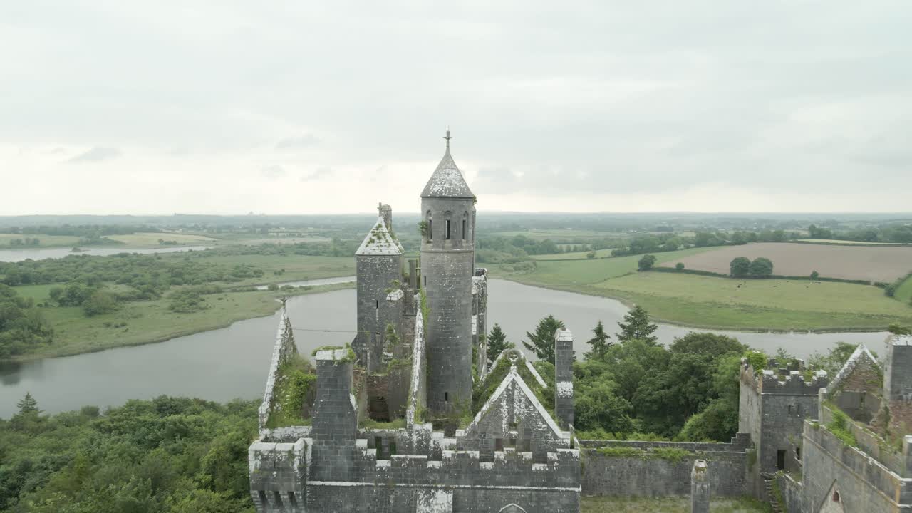 Historic Castle Overlooking Water and Green Landscape