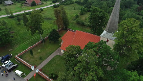 picturesque church with red and black roof