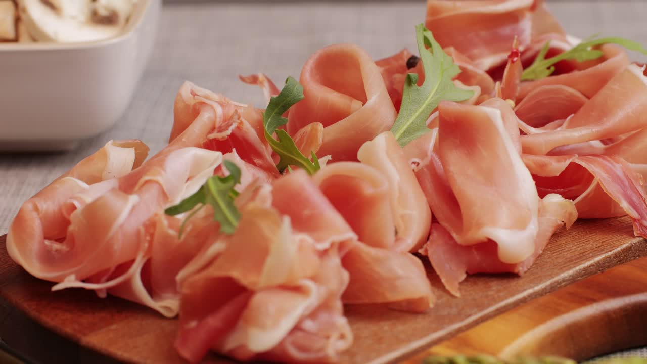 Italian or Spanish restaurant with traditional tapas food, Spanish cuisine, delicious tapas and cheese plate, bruschetta with cheese, olives dry tomatoes and tasty sandwich bar appetizer, buffet