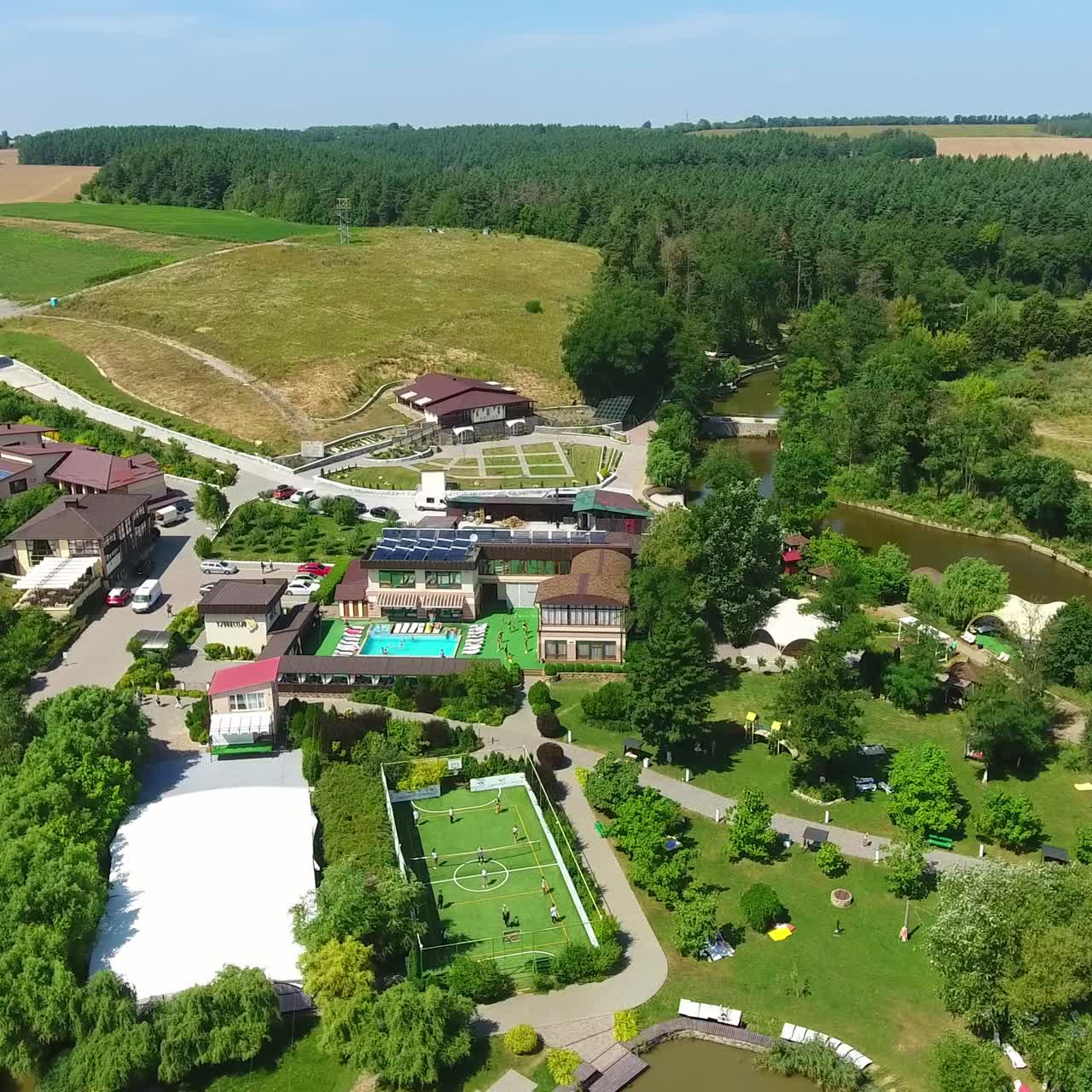 Recreational spa resort situated in the rural territory. Beautiful area for relax and fun at the backdrop of farmlands. Aerial view