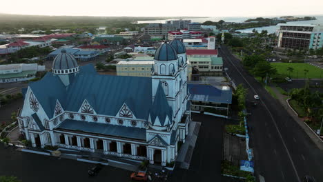 drone orbiting over restored architecture of immaculate conception cathedral in apia, samoa