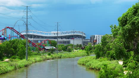 downtown denver colorado mile high stadium broncos nuggets avalanche peaceful south platte river elitch gardens amusement park cityscap lush green summer pan to the left movement