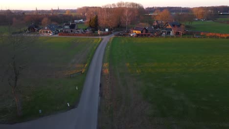 drone shot of cars driving down a country road