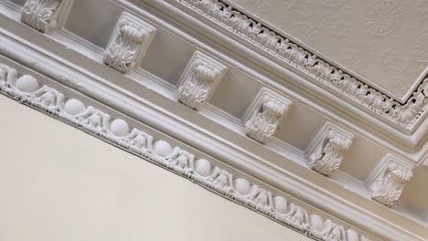 traditional cornicing - moulding on a ceiling in a bright room | retro interior design | shot in hd at cinematic 24 fps