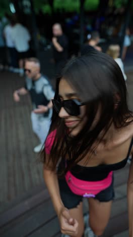 young woman dancing at a summer outdoor party