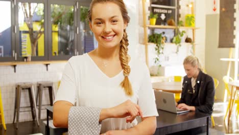 Portrait-of-beautiful-waitress-standing-with-napkin-4k