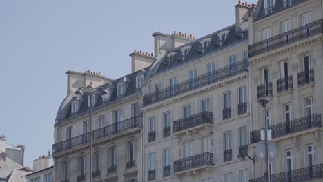 close up of apartment blocks in paris france viewed from river seine in slow motion 1