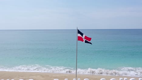 dominican republic flag waving on jetty at sans souci, santo domingo