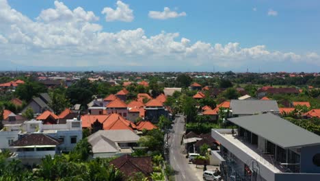 shops being constructed in local umalas neighborhood in bali on sunny day, aerial