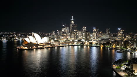 sydney opera house and city skyline at night