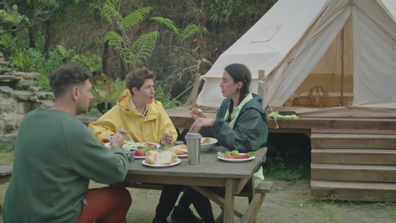 Tourists Chatting Over Dinner at Glampsite