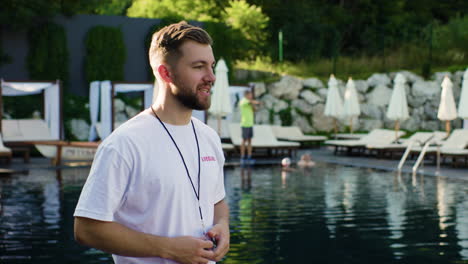 lifeguard using whistle in the swimming pool