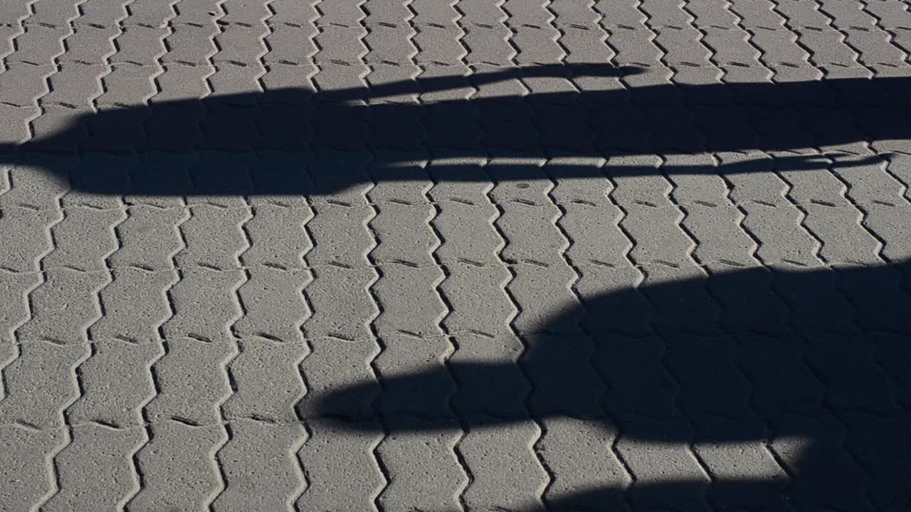 Light and shade, reflection of people in beams of the setting sun. People and shadows from them