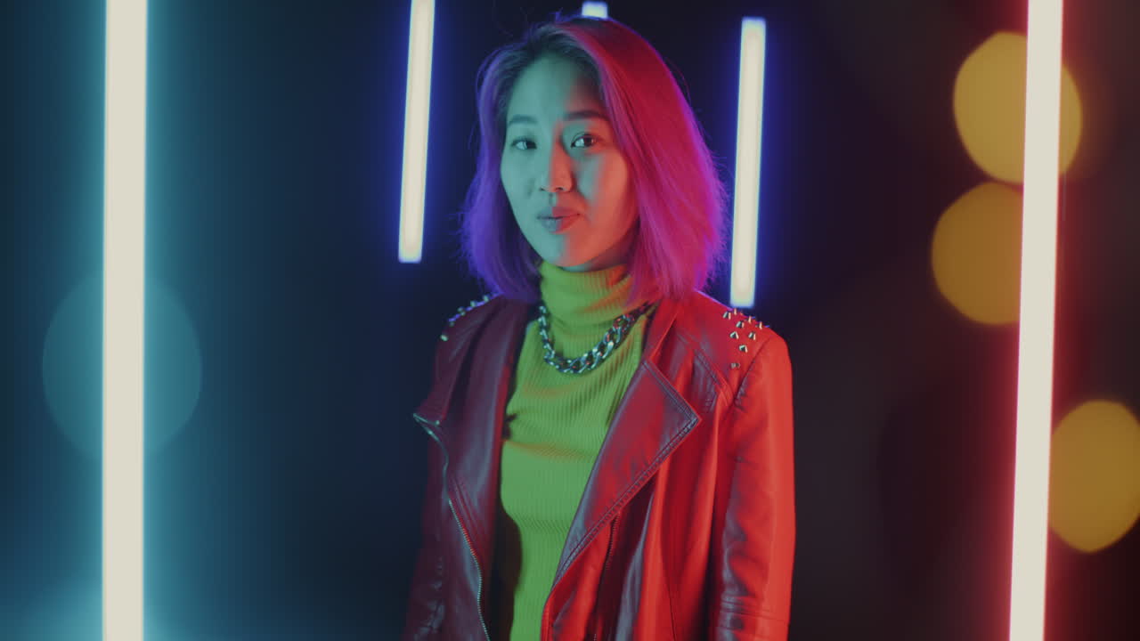 Young woman in vibrant neon lights