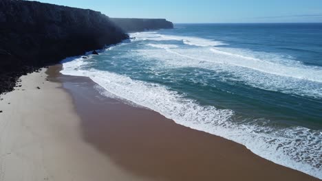 drone-flies-over-the-beach-of-telheiro-near-sagres-in-algarve,-perfect-sunny-weather