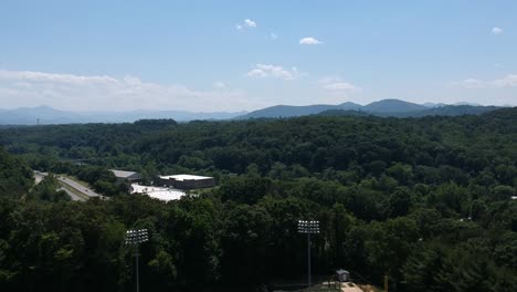 Aerial-footage-of-an-interstate-with-mountains-in-the-horizon