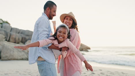 Parents,-child-and-airplane-play-at-beach