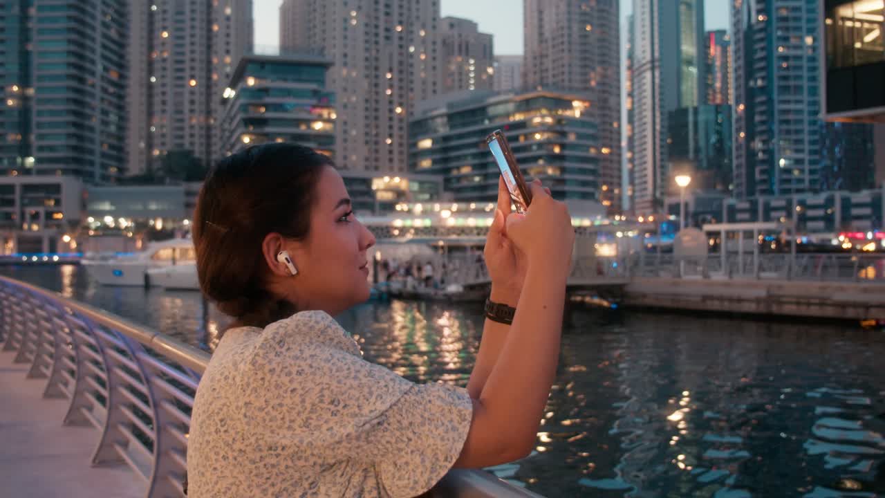 Young vlogger girl filming on cell phone