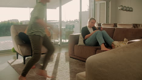 family working and playing together in living room