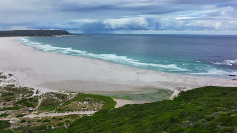 noordhoek long beach chapman peak south africa aerial cinematic drone surf waves crashing coastline cape town hout bay fish hoek good hope simon's town stunning aqua deep blue water white sand upward