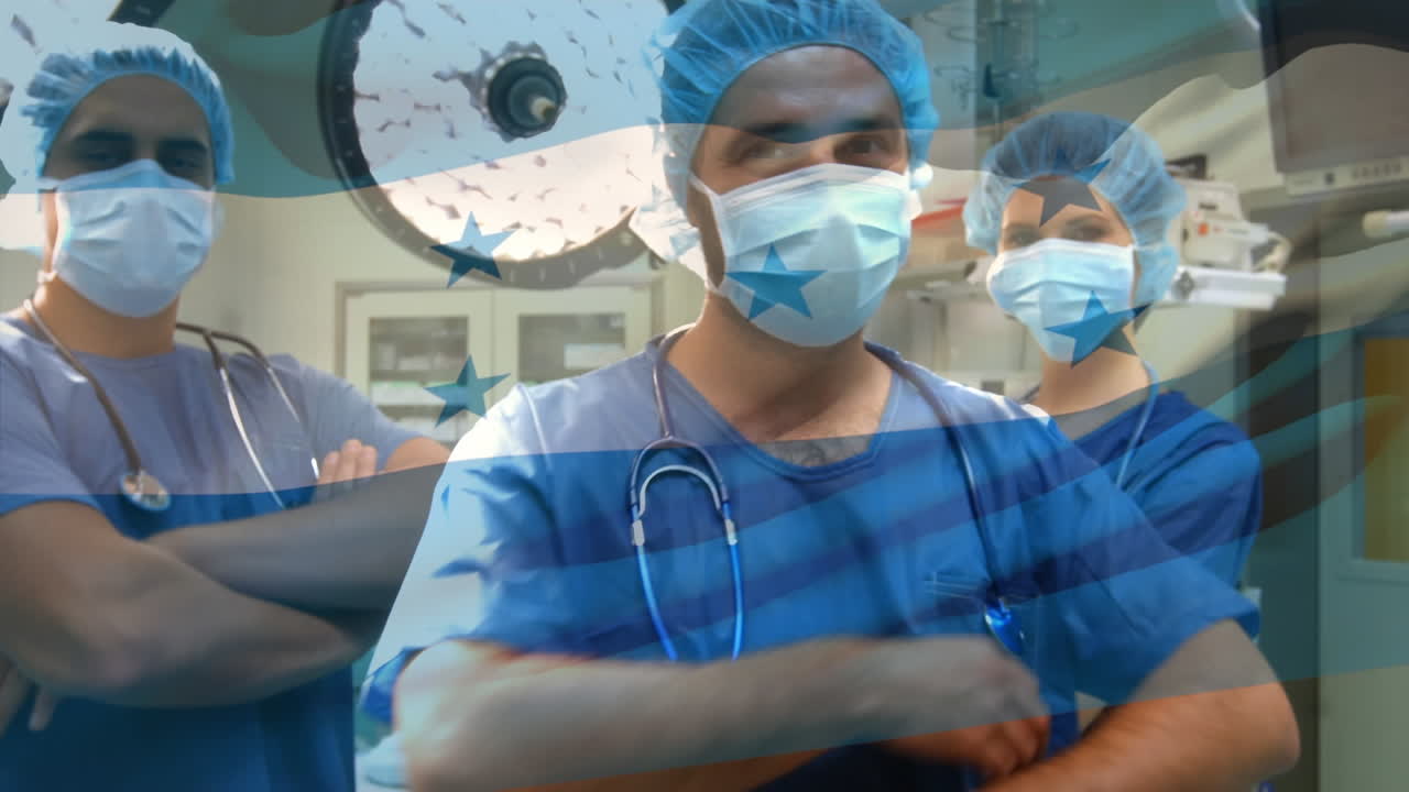 Animazione della bandiera dell'Honduras che sventola su chirurghi in sala operatoria