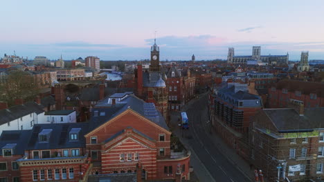 low drone shot of york city rooftops at blue hour yorkshire uk