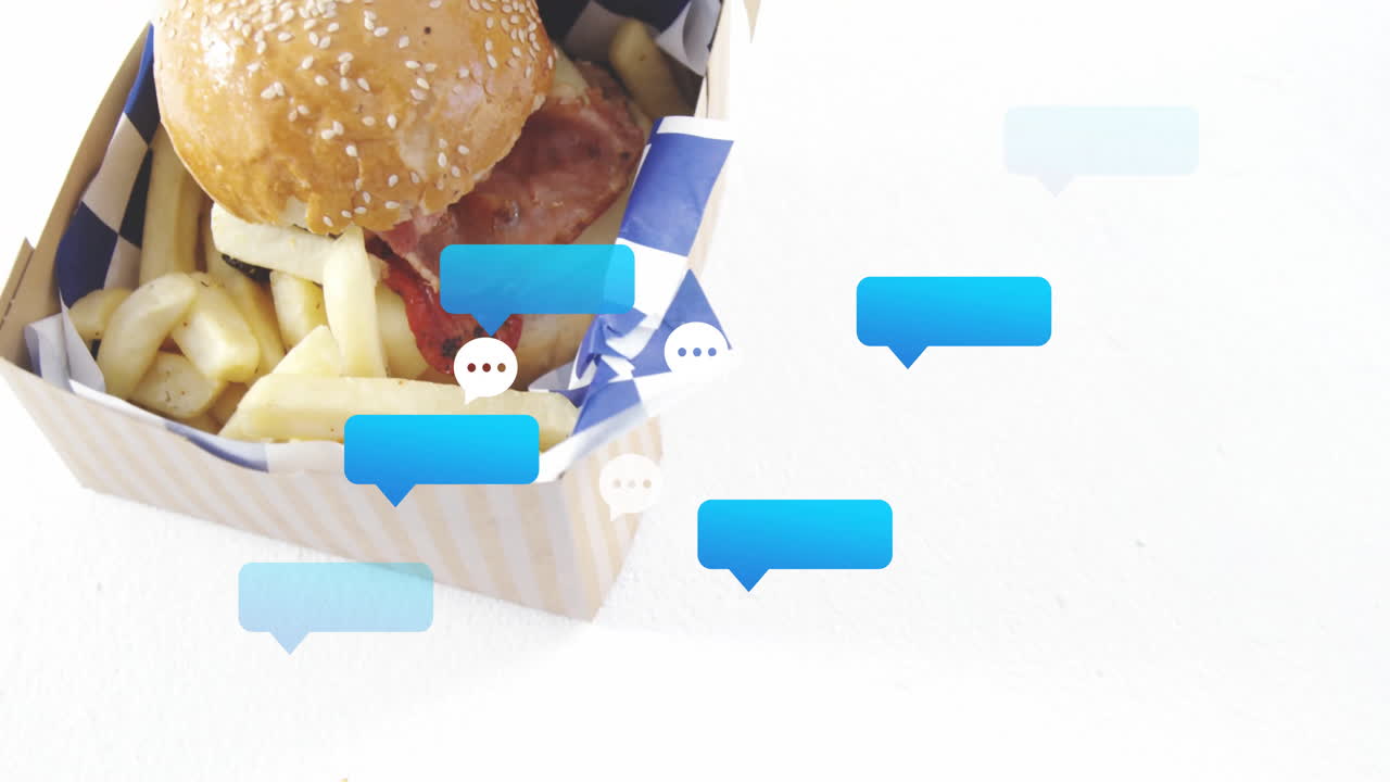 Animation of burger and fries in box with blue chat bubbles above them