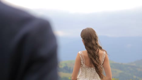 happy bride and groom kissing in a beautiful outdoor wedding setting a joyful bride and groom kissing in a sunlit field sharing smiles and laughter as they celebrate their special day in a picturesque outdoor setting surrounded by nature