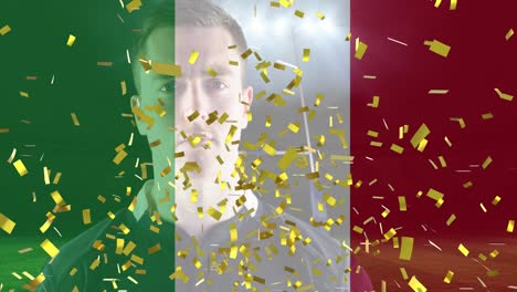 golden confetti and italy waving flag against caucasian male rugby player holding a rugby ball