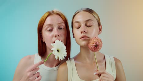 two women with flowers