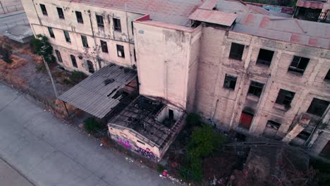 tilt up of the abandoned and burned former maternity of barros luco hospital - santiago chile