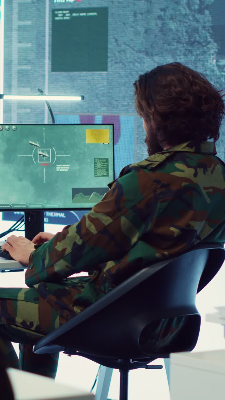 Man in Military Uniform Operating Computer in Control Room