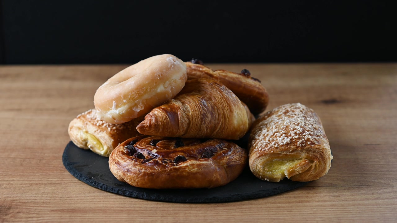 Hand picking sweet pastries