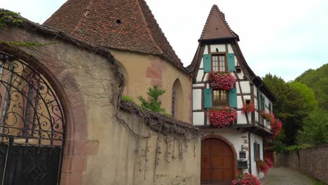 beautiful house decorated with flowers in kayserberg village