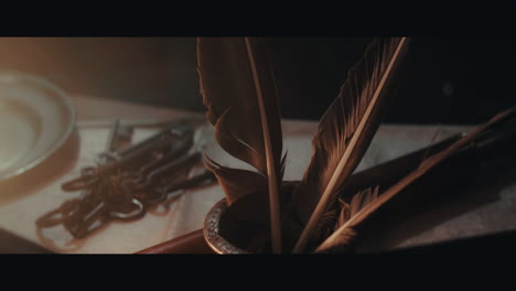 an old inkwell with quills for writing on the table filled with documents and maps inside the sailing ship cabin