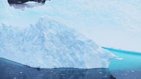 antarctica iceberg ice formation floating in ocean close up, blue antarctica icebergs with amazing shapes in antarctic peninsula sea water in winter seascape, iceberg detail in icy seascape landscape