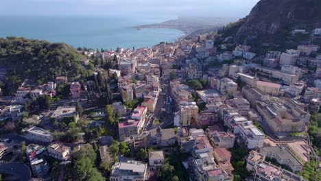 aerial orbit shot of taormina, sicily, italy a famous tourist destination, north side of the city