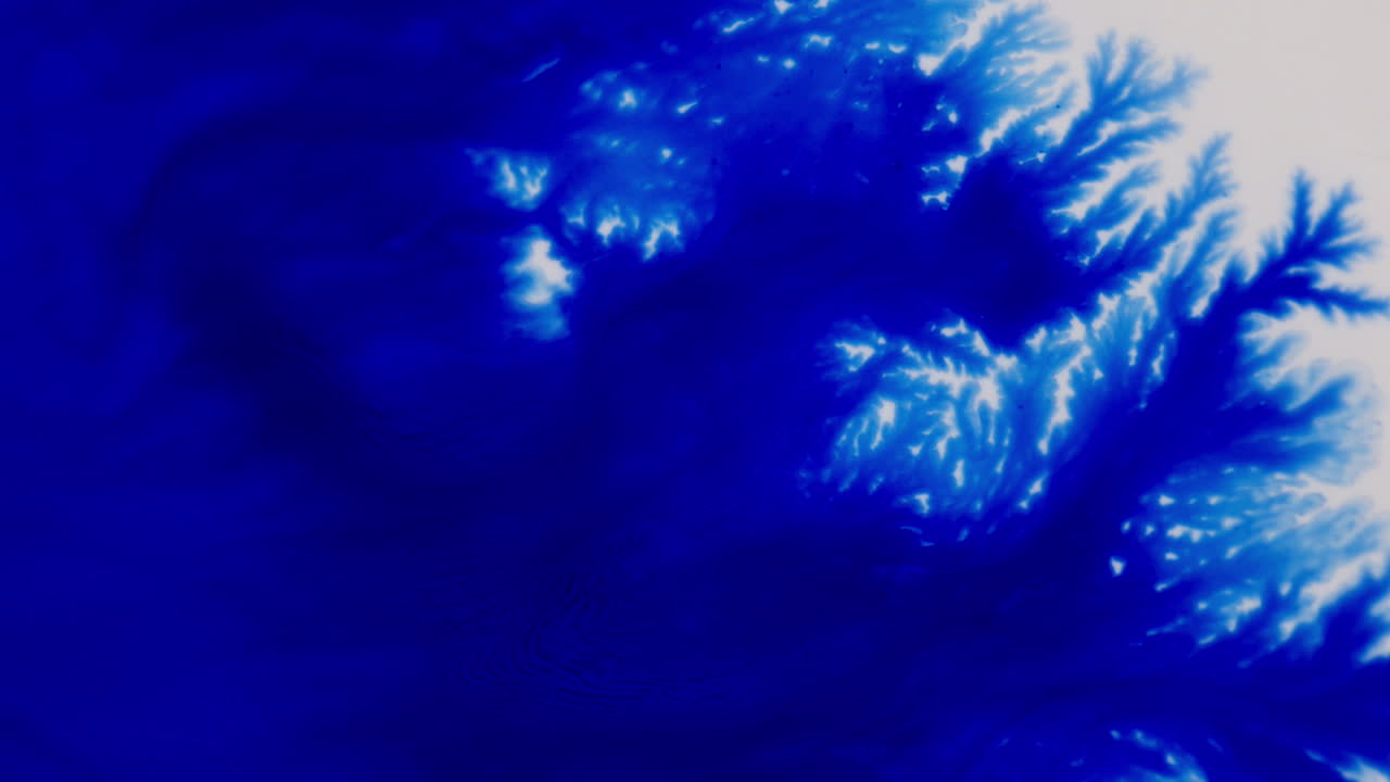 Abstract Vibrant Blue Dye In White Backdrop