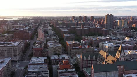 aerial footage pans down on harlem rooftops in nyc