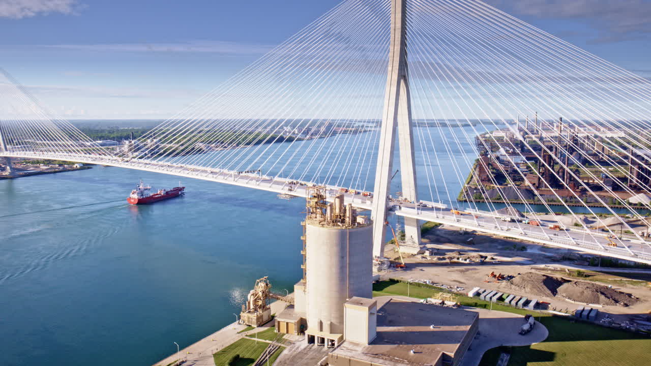 Aerial drone footage in cinematic style orbiting the bridge that spans the U.S.–Canada border