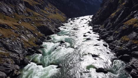 river flowing through a rocky gorge with rapids
