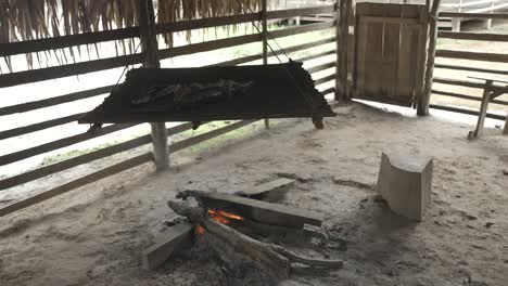 Indigenan-food-cooking-barbecue-in-the-tribe,-in-the-Amazon-rainforest