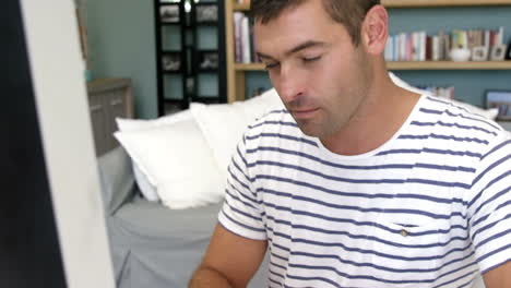 man typing on keyboard