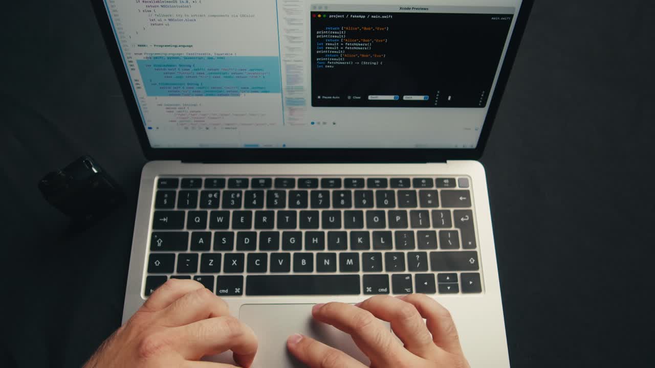 Overhead View of Person Typing Code on Laptop and Vaping