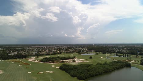 An-aerial-shot-on-a-beautiful-day,-residential-area-can-be-seen-in-the-distance