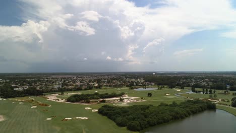 an aerial shot on a beautiful day, residential area can be seen in the distance