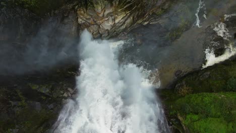 overhead view of fervenza do toxa waterfalls through rocks in forest in pontevedra, galicia spain