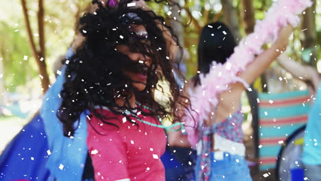 celebrating with confetti falling, woman enjoying animation at outdoor party