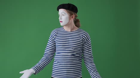 confused mime artist over green background