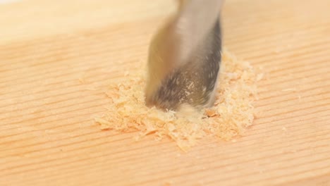 drilling a Hole in Wood Power Tool Drill which Drills a Hole in a Wooden Board Drilling a Hole in Wood Power Tool Drill which Drills a Hole in a Wooden Board